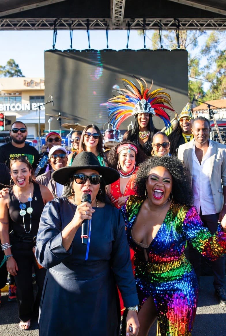 Artists and community at a vibrant event, representing grant applications and creative support.