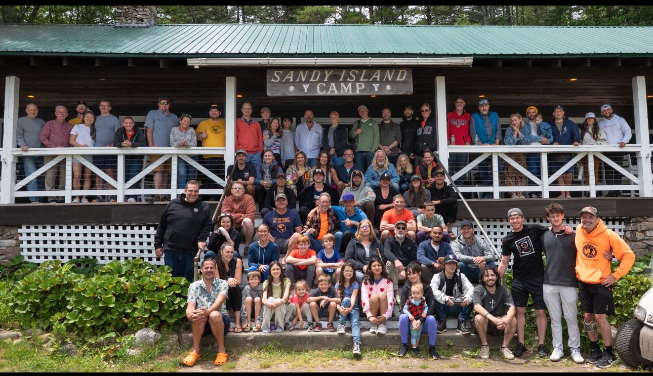 The full Camp Nakamoto 2026 group on Sandy Island, Lake Winnipesaukee
